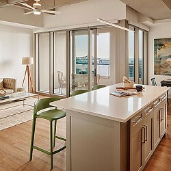 A kitchen with a glass door.
